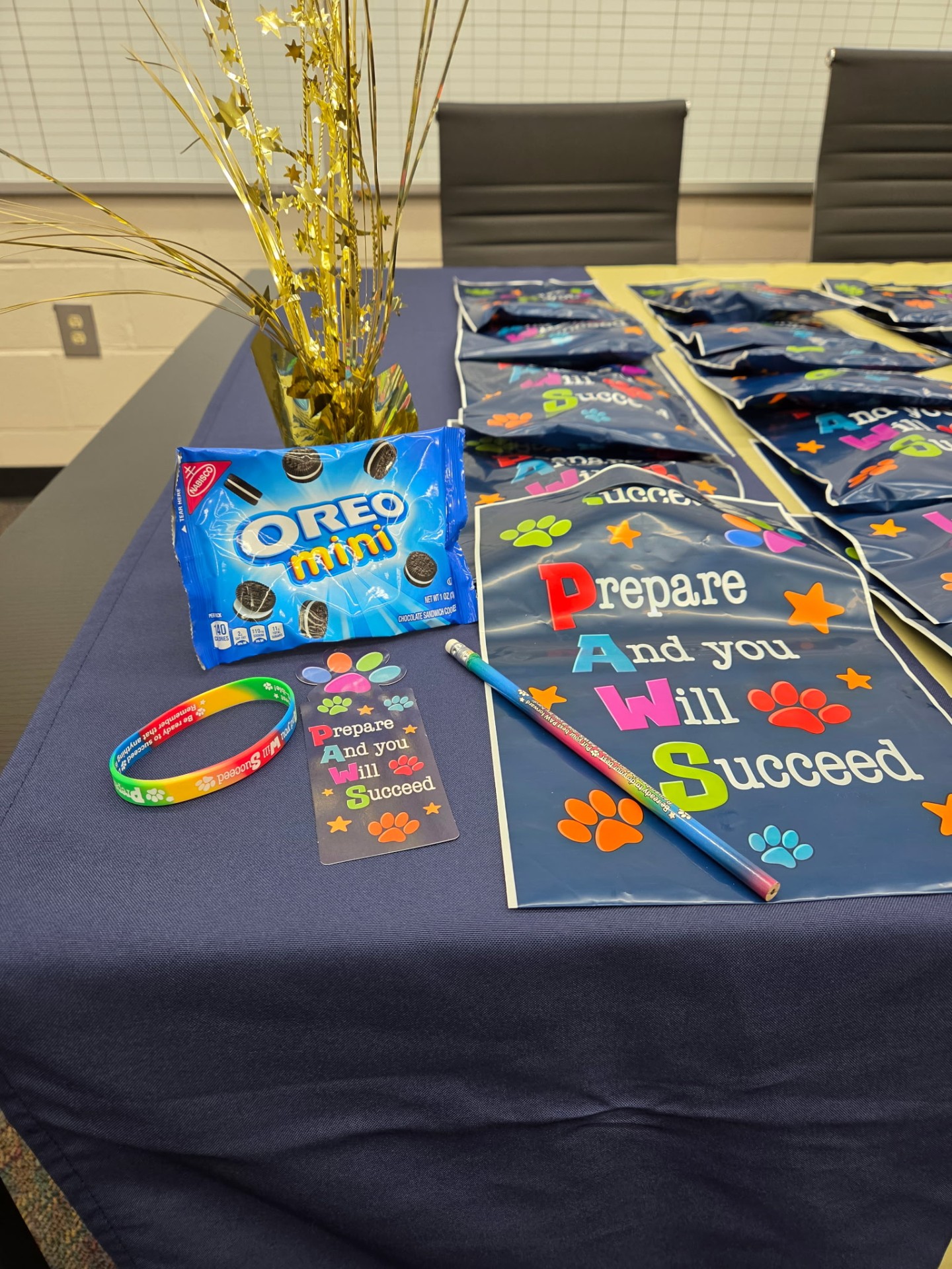 Goodie bags, Oreo minis, pencils, wristbands, and certificates prepared for the Sanders Elementary perfect attendance celebration