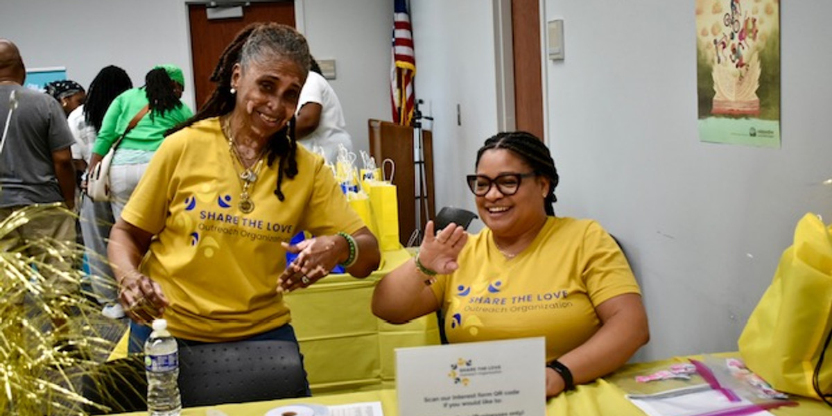 Volunteers sorting donations together at an outreach event